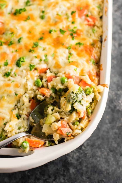 healthier vegetable rice casserole with sharp cheddar and parmesan. Everyone goes crazy for this and it makes a TON! #sidedish #casserole #vegetablerice #rice #vegetarian #dinner Adventist Recipes, Vegetable Rice Casserole, Veggie Casseroles, Vegetarian Casserole Recipes, Delish Dinners, Wild Rice Casserole, Vegetable Casserole Recipes, Vegetarian Casserole, Chicken Tikka Masala Recipes