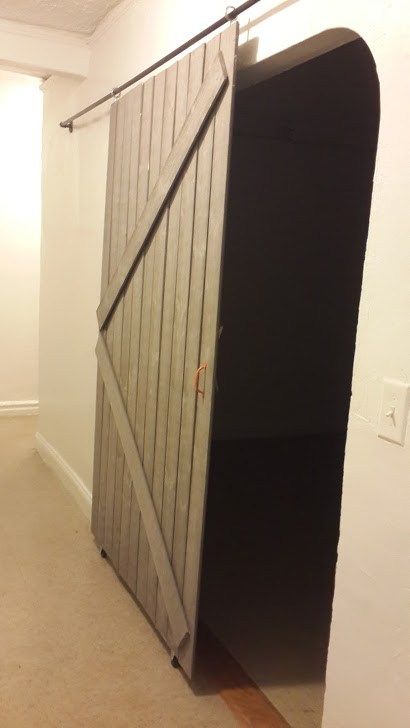 Remodelaholic | DIY Sliding Barn Door + Inexpensive Hardware Cheap Room Dividers, Room Divider Decor, Temporary Room Dividers, Small Room Divider, Barn Door Ideas, Hanging Room Divider, Fabric Room Dividers, Portable Room Dividers, Diy Sliding Door