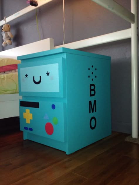 Reesey & I finally finished our little nightstand project.. she painted the whole nightstand and I did the face of the cut outs... It's from her favorite cartoon.. Adventure Time her name is BMO.  I think we didn't amazing job and it is super juku Adventure Time Room Aesthetic, Cartoon Decoration Room Decor, Adventure Time Home Decor, Adventure Time Furniture, Adventure Time Themed Room, Adventure Time Room Ideas, Adventure Time Bedroom Ideas, Adventure Time Mural, Adventure Time Diy Decor