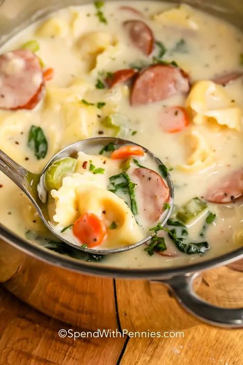 Tasty and creamy, tortellini soup is the best with sausage, spinach, and broth. Perfect for dunking and dipping, this soup loves garlic bread! #spendwithpennies #creamytortellinisoup #maindish #recipe #crockpot #instantpot #stovetop #sausage #spinach #easy #slowcooker Creamy Tortellini, Creamy Tortellini Soup, Sausage Tortellini Soup, Sausage Spinach, Recipe Crockpot, Sauteed Green Beans, Chicken Rice Soup, Spend With Pennies, Creamy Mushroom Sauce