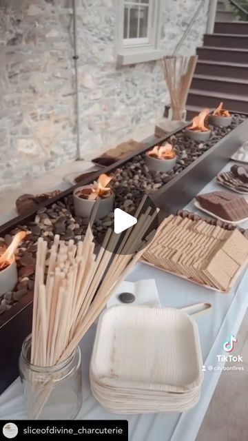 City Bonfires® on Instagram: "I don’t think they ever want their guests to leave, do you? We wouldn’t, lol.   Now that’s how to do a s’mores table! Simple. Sweet. Elegant. Easy.   LOVE IT! Gorgeous as ever! 🙏❤️📹 @sliceofdivine_charcuterie   #smores #party #tabletopfire #specialevent #eventplanner #wedding #rehearsaldinner #smoresbar #thisisheaven" Portable Smores Station, Smores At Wedding, Smore Table Ideas, S’mores Station Ideas Diy, Smores Buffet Bar Ideas, Smores Table Wedding, Smores Station For Party, Smores Bars Party Ideas, S’mores Bar Ideas