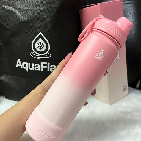 Aquaflask's 22 oz Pixie Dust bottle boasts a vibrant and eye-catching design. With double-walled stainless steel construction, it keeps drinks cold for up to 24 hours and hot for up to 12 hours. The leak-proof lid ensures you can safely toss it in your bag without fear of spills. Aquaflask Aesthetics, Pink Aquaflask, Aquaflask Design Ideas, Tumbler Aquaflask, Flask Aesthetic, Pink Penthouse, Stylish School Bags, Girls Dress Outfits, Study Stationery