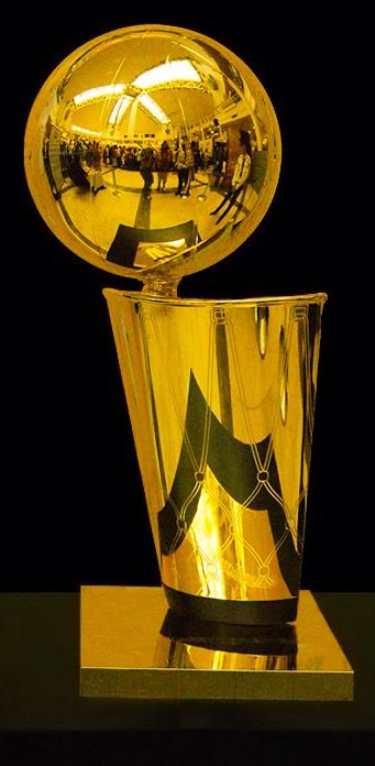 The Larry O'Brien NBA Championship Trophy is the championship trophy awarded annually to the National Basketball Association (NBA) Finals winner after the conclusion of the NBA Playoffs and NBA Conference Finals, and has been a new name of the Walter A. Brown Trophy since 1984. Basketball Championship Trophy, Nba Trophy Wallpaper, Larry O'brien Trophy, Nba Finals Trophy, Nba Trophy, Nba Championship Trophy, Nba Championship Rings, Magazine Basket, New York Basketball