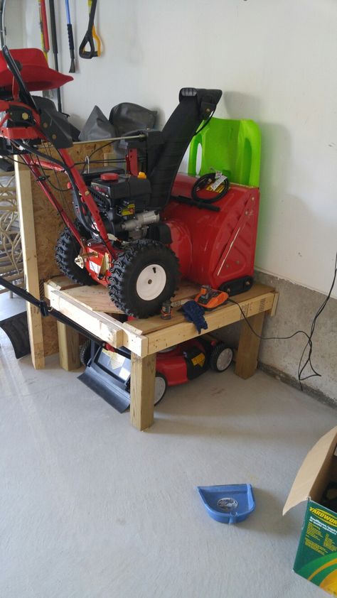 Space saver for garage lawn mower and snow blower on top Garage Snowblower Storage, Mower And Snowblower Storage, Garage Organization Lawn Mower, Garage Organization Ideas Lawn Mower, Lawn Mower Snow Blower Storage, How To Store Lawn Mower In Garage, Snowblower Storage In Garage, Snow Blower Storage Ideas, Weedeater Storage Ideas