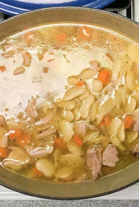 This lima bean soup is flavored with vegetables and a ham bone as it simmers slowly into a thick, hearty, and budget-friendly meal. #chili #soup #soupideas #soupinspiration #souprecipes #stew Ham Lima Bean Soup, Lima Bean And Ham Soup, Lima Bean Soup Recipes Ham Bone, Lima Bean Soup Crockpot, Ham And Lima Bean Soup Recipes, Ham And Lima Bean Soup, Bean Soup With Ham Bone, Lima Beans In Crockpot, Soup With Ham Bone