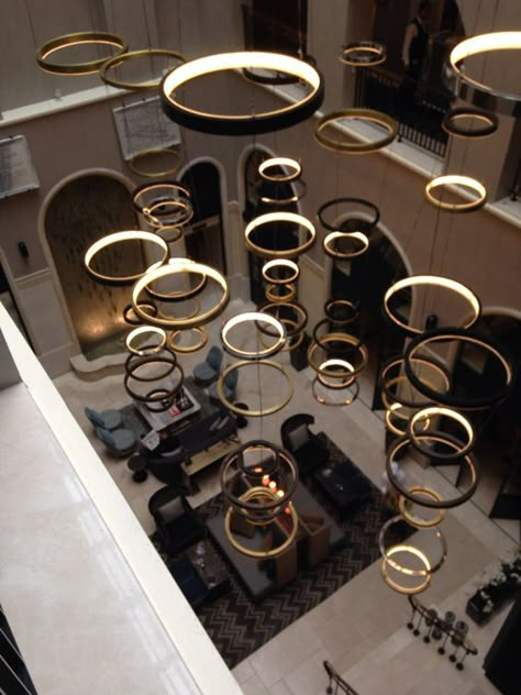 30+ Circular Ceiling Lights (BEST OF PINTEREST) - The Architects Diary Circular Ceiling Light, Luminaria Diy, Lobby Furniture, Elevator Lobby, Hotel Lobby Design, Indoor Pools, Pandora Ring, Hotel Interior Design, Lobby Design