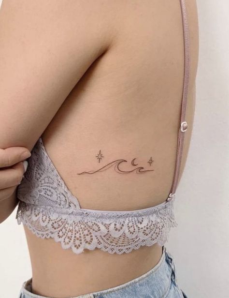 Wave Tattoo With Name, Wave Tattoo Placement Ideas, Ocean Tramp Stamp, Wave Tattoos For Women, Ocean Lover Tattoo, Simple Tattoo With Meaning, Tattoos On Side Ribs, Small Wave Tattoo, Small Girly Tattoos