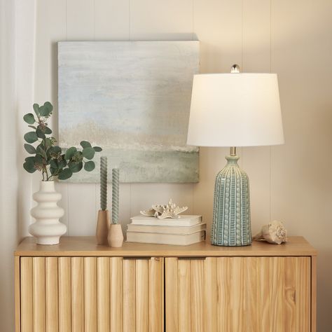 Bring raw beauty to your surroundings with this transitional table lamp. Made from ceramic with a raw unfinished texture, it adds a distinctively natural element to your side table or nightstand. Enjoy a relaxing modern vibe with its white empire shade that diffuses a cool glow. Boho Coastal Bedroom, Beaded Table, Farmhouse Table Lamps, Jar Table Lamp, Modern Coastal Decor, Modern Farmhouse Table, Transitional Table Lamps, Ceramic Texture, Coastal Modern