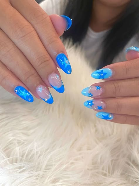 There's a new beauty trend taking over Instagram and it's absolutely stunning. Say hello to "quartz nails". Fun Blue Acrylic Nails, Almond Beach Nails Ideas, Acyrilics Nails Ideas Summer, Designs On Blue Nails, Outgoing Nails, Summer Nail Ideas Bright, Star Summer Nails, Cute Summer Nails Almond Short, Nail Inspo With Stars