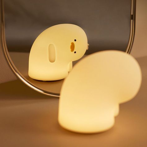 Your perfect night light for kawaii or pastel korean aesthetic room. This silicone rubber melancholy sad duck lamp will bring a touch of cuteness to your desk or bedside table. Best to use as a night light and phone stand. Warm white light, adjustable brightness, automatic 30 minutes sleep timer; Package includes: 1x Night Light Lamp, 1x USB type-c charge cable Dimmable Warm White light 1200 mAh USB Rechargeable Battery works for 4-6 hours 30' Sleep timer Type-C Charging Port (Fully charged for Raccoon Lamp, Pastel Korean Aesthetic, Korean Aesthetic Room, Kawaii Furniture, Kawaii Lamp, Cute Lamps, Duck Lamp, Silicone Lamp, Cute Night Lights