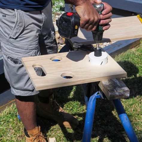 DIY folding wine holder perfect for picnics and the beach | Better Homes and Gardens Folding Wine Table Plans, Diy Wood Wine Glass And Bottle Holder, Wine Flight Boards Diy, Drink Holder Diy, Beach Cup Holder, Campsite Decorating, Folding Wine Table, Caddy Diy, Woodworking Bandsaw