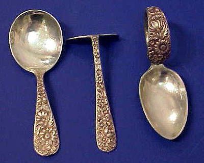 BABY FOOD PUSHER  When learning to use silverware, children inevitably get help from their fingers—not in a Victorian household. To prevent this, children were given a hoe-like tool to push their food onto their fork. Here, this short utensil is seen between two other children’s spoons.    Sterling Repoussé Baby Spoon and Pusher Set, 3½” in length; sold for $110. Baby Trends, Antique Flatware, Baby Dishes, Victorian England, Silverplate Flatware, Baby Bowls, Vintage Scale, Silver Cutlery, Antique Silverware