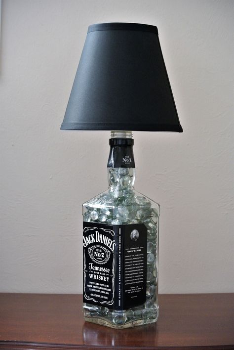 Beautiful Jack Daniels bottle lamp.   What a GREAT GIFT for a whiskey lover! Gets yours @ lookingsharpcactus.com  #lookingsharpcactus #jackdaniels #jackdanielswhiskey #jackdanielsbottle  #jackdanielslight #whiskeybottle #whiskeygifts #whiskeylover #bottledecor #giftideasforher #giftideasfriends  #homedecor #instagood #alcoholbottle #alcoholgift #industriallighting  #industriallights #bottlelamp #bottlelamps #boyfriendgift #boyfriendgifts #giftforhusband #dormlights #liquorbottles #bourbongifts Jack Daniels Lampe, Jack Daniels Decor, Glass Bottle Lamp, Diy Bottle Lamp, Room Lights Decor, Liquor Bottle Lamp, Glass Liquor Bottles, Jack Daniels Bottle, Liquor Bottle Crafts