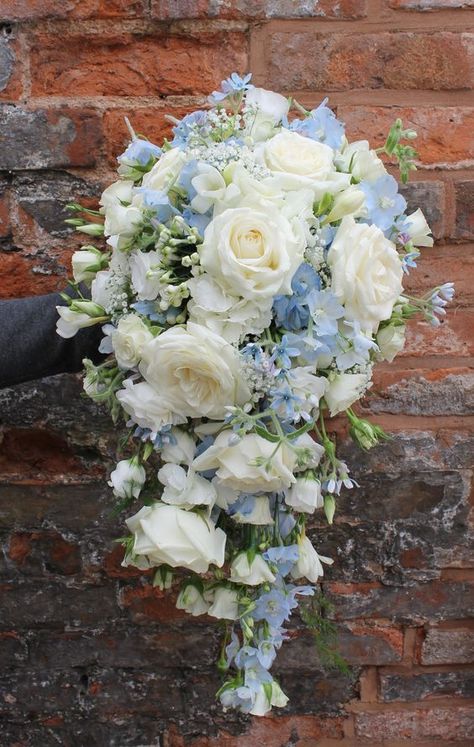 16 Stunning Summer Wedding Flowers---dusty blue delphiniums and white roses wedding bouquets for secret garden weddings, woodland weddings, elegant wedding theme, diy bridal bouquets Delphinium Blue, White Rose Wedding Bouquet, Elegant Wedding Themes, Cascading Bridal Bouquets, Cascading Wedding Bouquets, Diy Bridal Bouquet, White Roses Wedding, Blue Delphinium, Blue Wedding Bouquet