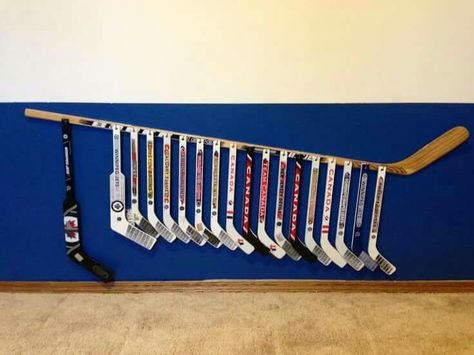 Mini hockey stick display Mini Hockey Stick Storage, Hockey Stick Storage, Hockey Organization, Hockey Diy, Boutonniere White, Stick Storage, Hockey Bedroom, Hockey Decor, Hockey Room