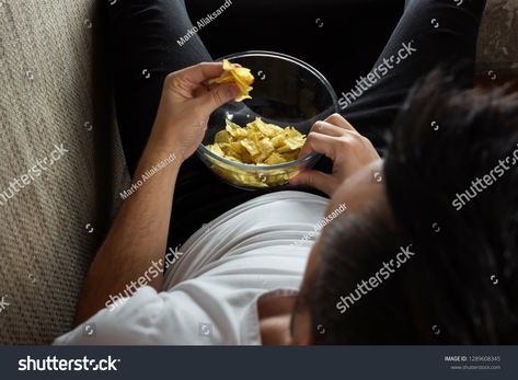 The guy in the shirt is lying on the couch, eating chips and watching a sports channel. The concept of laziness, frustration, procrastination, the person at home. #Ad , #sponsored, #eating#chips#watching#couch Guy Eating, Men Cry, Sports Channel, Merchandise Design, Design Vector, Abstract Design, Color Design, Royalty Free Stock Photos, Stock Images