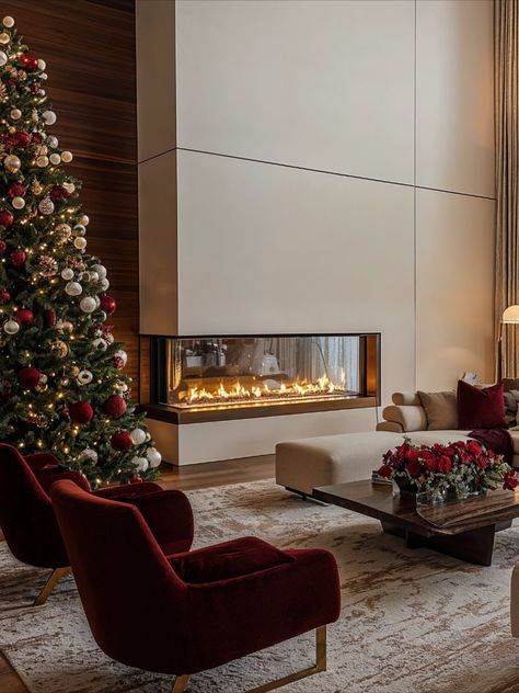 Rich reds, sparkling golds, and a cozy fireplace bring holiday luxury to life. This is Christmas decor with style! ✨🎁 #ClassyChristmas #LuxuryChristmasDecor Luxury Christmas Decor, Designer Room, This Is Christmas, Classy Christmas, Christmas Themes Decorations, Cozy Fireplace, Modern Christmas, Interior Design Trends, Christmas Magic