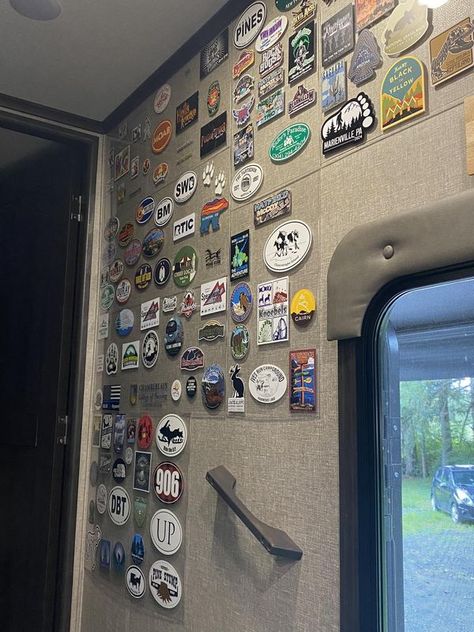 RV Storage, Space and Organizing Ideas | You can only buy so many mugs at places you visit so years ago I started collecting stickers | Facebook Stickers Collection Display, Collecting Stickers, Sticker Display, Rv Dreams, Camping Set Up, Camping Storage, Diy Display, Rv Storage, Camping Set