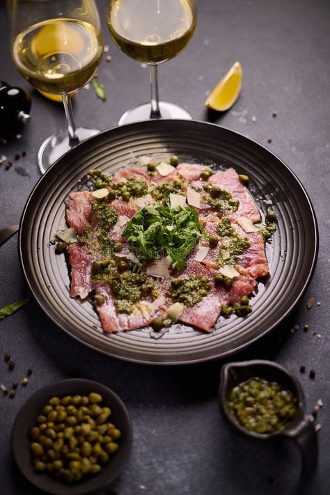 Tuna carpaccio - slices of fresh raw tuna fillet on black ceramic plate royalty free stock photography Carpaccio Photography, Tuna Carpaccio, Raw Tuna, Tuna Fillet, Vector Banner, Ceramic Plate, Stock Photography Free, Black Ceramic, Ceramic Plates