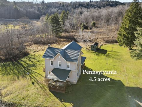 Four bedroom, one bath Pennsylvania farmhouse for sale on 4.5 country acres.     4 bed 1 bath 1,752 sqft 4.5 acre lot   About This c.1900 Pennsylvania Farmhouse For Sale on 4.5 Acres Explore this charming 4-bedroom, 1-bathroom colonial-style home on 4.5 acres near Glen Hope. Updates within the last decade include a new roof, furnace, kitchen, and bathroom. #acreage #affordablehome #brickhomeforsale #brickhouseforsale #bungalowforsale #bungalowsforsale #cheaphouses Pennsylvania Homes, Pennsylvania Farmhouse, Pennsylvania Houses, Pennsylvania Forest, Greene County Pennsylvania, Modern Kitchen Appliances, New Washer And Dryer, Bungalows For Sale, Cheap Houses