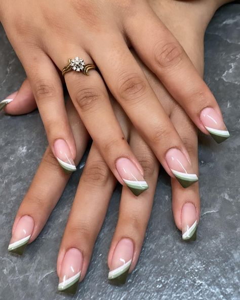 Almond acrylic nails get a refined makeover with olive green French tips. Our blog post guides you through a variety of designs, from simple and elegant to creatively adorned styles. See how this unique color can transform your almond acrylic nails into a statement of glamour and sophistication, perfect for any occasion. Check our roundup of the best nail design ideas! Olive Green French Tip, Olive Green French Tip Nails, Green French Tip Nails, Green French Tips, Green French Tip, French Manicure Nail Designs, Lime Green Nails, Olive Nails, Almond Acrylic