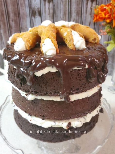 a very tall triple layer chocolate cake dripping with chocolate fudge and topped with cannolis Chocolate Cannoli, Triple Layer Chocolate Cake, Layer Chocolate Cake, Cannoli Cake, Quinoa Cake, Cannoli Filling, Triple Chocolate Cake, Chocolate Layer Cake, German Chocolate Cake