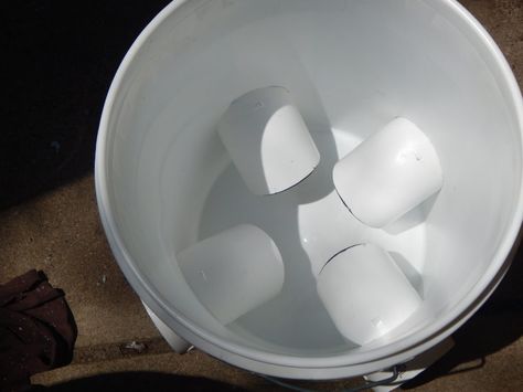 DIY Chicken Feeder (from a 5 gallon bucket!) Bucket Chicken Feeder, Aesthetic Farm Animals, Diy Chicken Feeder, Pvc Chicken Feeder, Chicken Feeder Diy, Diy Bucket, Portable Chicken Coop, Chicken Tractors, Chicken Feeders