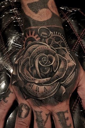 Tattoo uploaded by Mike Flores | Clock rose | 846474 | Tattoodo Men’s Hand Tattoos Rose, Cash Rose Tattoo, Clock Tattoo Design For Men Hand, Clock Tattoo Design Hand, Forearm And Hand Tattoo, Hand Clock Tattoo, Clock Hand Tattoo, Rose Clock Tattoo, John Tattoo