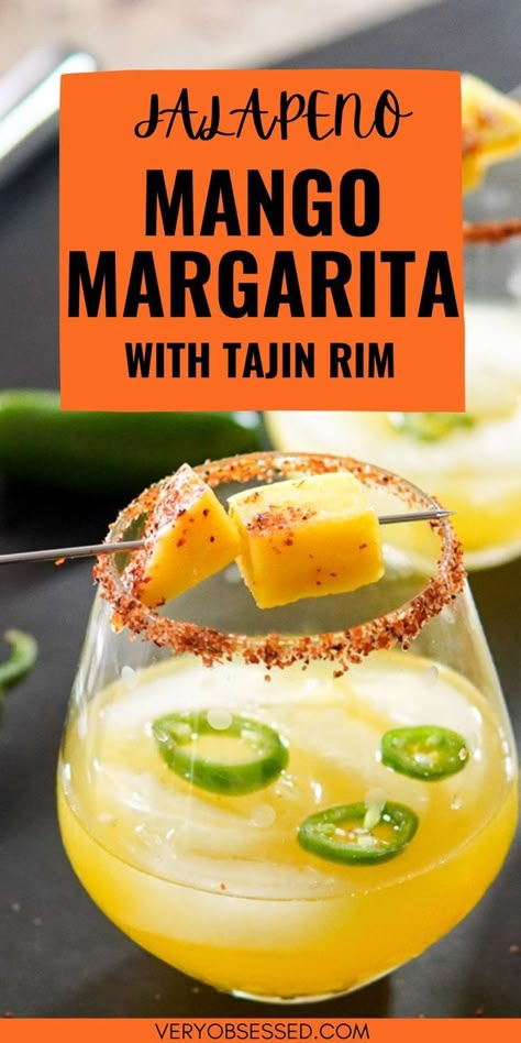 Jalapeno Mango Margarita in a Stemless glass with Tajin Rim and Fresh Mango garnish Jalepeno Mango Margarita, Cocktails With Tajin Rim, Mango Margarita Recipe On The Rocks, Tajin Drink Recipes, Spicy Margarita Recipe Easy, Spicy Tequila Drinks, Easy Margarita Recipes On The Rocks, Tajin Cocktails, Mango Margarita Recipe Frozen