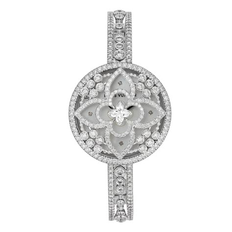 Introducing the extraordinary Louis Vuitton Les Ardentes Secret Diamond Watch, an exquisite masterpiece that exudes opulence and sophistication. This unmistakable timepiece showcases a plethora of round brilliant cut diamonds, with a stunning total of 485 diamonds adorning its intricate design. At the center, a flower-shaped diamond takes center stage, crafted with a special and intricate design that reveals additional brilliance through its numerous facets. The watch case and band are meticulou Luxury White Gold Diamond Watch With Accents, Luxury Diamond Watch With Diamond Accents, Elegant Luxury Diamond Watch, Louis Vuitton Watch For Women, Luxury Gold Elegant Diamond Watch, Luxury Gold Diamond-accented Watch, Iphone Wallpaper Violet, Louis Vuitton White, Flower Watch