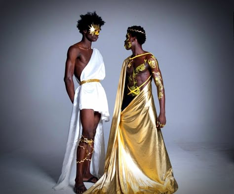 Black male models dressed as the sum and moon Sun Costume Man, Sun God Outfit Male, Sun Themed Outfits Male, Sun God Costume, Greek God Outfits Men, Greek Fashion Men, Greek God Costume Male, Greek Inspired Fashion, Mythology Costumes