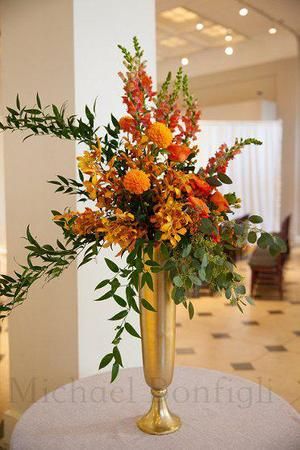 Tall Vase Flower Arrangements, Gold Vase Flowers, Tall Gold Vases, Tall Vase Arrangements, Vase Filler Ideas, Carnegie Library, Tropical Flower Arrangements, Altar Arrangement, Altar Flowers