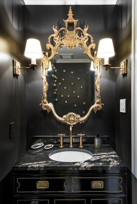 Gold and black powder room boasts walls painted bold black lined with a gold chinoiserie mirror ... Black Powder Room, Chinoiserie Mirror, Gold Bad, South Shore Decorating, Revere Pewter, Classic Bedroom, Gold Bathroom, Trendy Bedroom, Bath Room