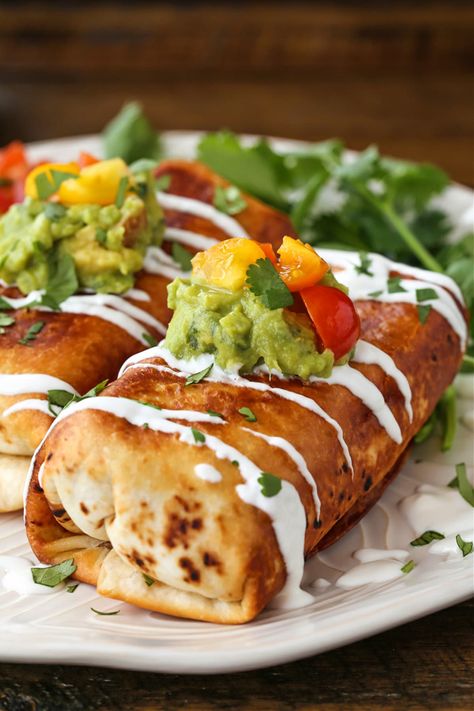 Chicken Chimichangas are perfectly crispy and oozing with flavor! A shredded chicken and cheese filling tucked inside a crispy, pan-fried tortilla. A delicious and fun dinner with a Mexican vibe! #chimichangas #burritos #chickenrecipes Chimichanga Recipe Chicken, Chimichangas Recipes, Homemade Chimichangas, Burrito Ideas, Chicken Chimichanga Recipe, Texmex Recipes, Mexican Cornbread Recipe, Chicken Chimichanga, Mexican Cantina