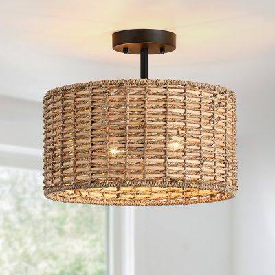 Nothing adds warmth and a casual inviting vibe like a natural woven semi-flush mount ceiling light. This flush mount is meticulously hand woven of natural rattan and seagrass in a drum silhouette. Inside, a 2-light cluster in matte black casts generous light and creates interesting shadow patterns on the walls of your entry, dining room or bedroom. This collection can work with a variety of decors, from boho, bohemian, coastal, eclectic, farmhouse to traditional styling, which is an ideal select Drum Silhouette, Bungalow Ideas, Rattan Shades, Traditional Style Decor, Basket Lighting, Room Stuff, Drum Chandelier, Semi Flush Mount Lighting, Farmhouse Lighting