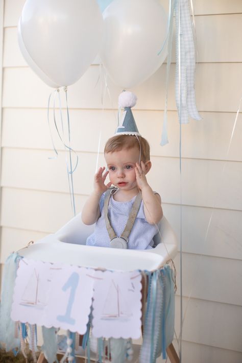 Sailboat themed first birthday party Boat First Birthday Party, Sailboat Birthday Party, Boat Party Theme, High Chair Decor, Sailboat Birthday, Sailor Birthday, First Birthday High Chair, Boat Theme, Birthday High Chair