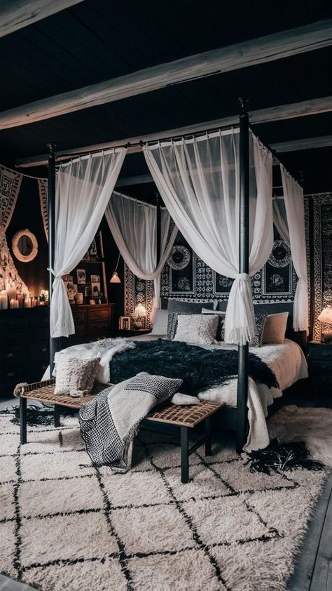 A cozy and stylish black boho-style bedroom. The room is adorned with dark wood furniture and cozy textiles, including a large canopy bed draped in black and white fabrics. A plush area rug covers the floor, and the walls are decorated with intricate black and white patterns. The room exudes a chic and relaxed ambiance, with plenty of candles and fairy lights adding to the cozy atmosphere., photo Canopy Bed Master Room Ideas, Black Bohemian Bedroom, Black Boho Bedroom, Canopy Bed Drapes, Black Boho Style, Black Canopy Bed, Cozy Textiles, House Bedroom Ideas, Black And White Patterns