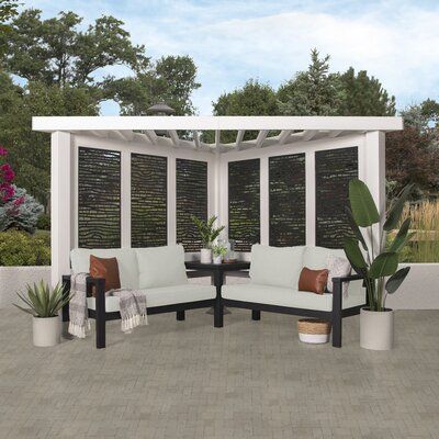 What do you get when maintenance-free design and shade meet privacy and flexibility? This cabana pergola with patio seating by backyard discovery! Constructed from 100% galvanized steel, the cabana pergola includes built-in steel seating with 4 colour options of market-leading Sunbrella® cushions, as well as an integrated side table, durable composite panels, and a soft canopy for privacy and shade. intended to wow, the unique architecture of the pergola will beautify any location with its funct Cabana Pergola, Conversation Seating, Bamboo Landscape, Corner Pergola, Steel Pergola, Modern Pergola, Wood Pergola, Pergola Canopy, Shade Canopy