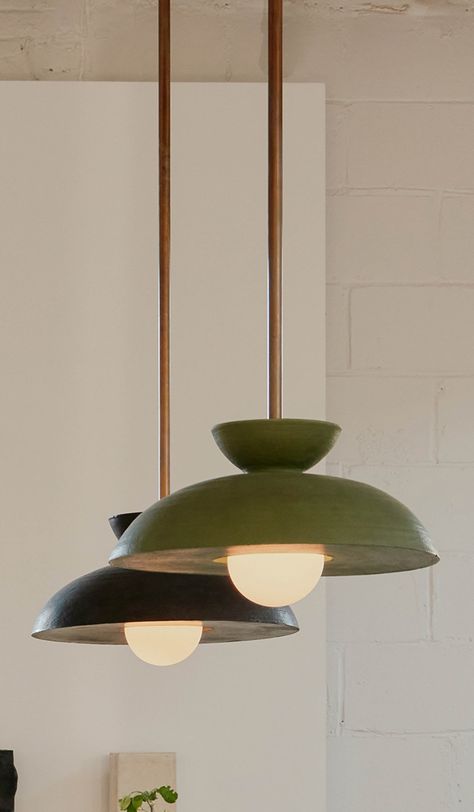 The Terra series is a collaboration between ceramicist Danny Kaplan and In Common With. Augustus is a statement pendant that adds the right amount of ambient light. Curving clay dish. Glass diffuser shade. Choice of satin 'anthracite' black (pictured), translucent 'stone' matte white (pictured), washy 'lapis' blue, crackle terra sigillata 'terrasig' white, matte 'ivy' green (pictured) or matte 'chestnut' brown finish. Finish samples can be ordered here. 4 7/8" self-leveling canopy. 17" diameter Large Scale Pendant Lighting, In Common With Lighting, Earthy Light Fixtures, Danny Kaplan, Contemporary Kitchen Lighting, Statement Kitchen, Art Deco Ideas, Clay Dish, Terra Sigillata