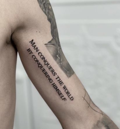 The Man Conquers Tattoo Quotes For Guys Tattoo Ideas For Men Arm Meaningful, Tattoo Designs Men Quote, Quotes For Tattoos For Guys, Mens Quote Tattoos, Men Quote Tattoos, Meaningful Tattoo Quotes For Men, Meaningful Men Tattoo Ideas Guys, Quotes Deep Meaningful Tattoo, Writing Tattoos For Men