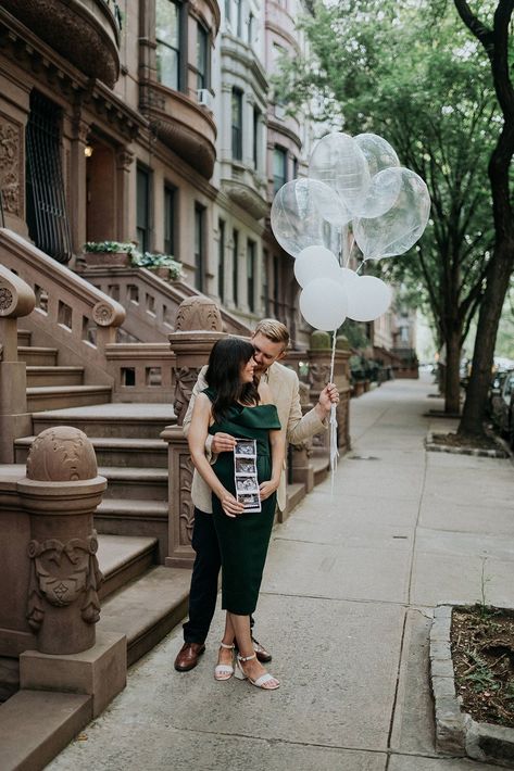 We're Having a Baby! - pregnancy announcement, pregnancy photography, balloons, pregnancy, maxi dress, floral dress, dress, growing family, family, maternity, women's fashion, women's style, Central Park, New York, architecture | @prettyinthepines, New York City Lifestyle Blog Nyc Baby Announcement, New York Pregnancy Announcement, City Pregnancy Announcement, Nyc Pregnancy Announcement, Pregnancy Announcement Balloons, City Maternity Shoot, Baby Announcement Winter, Outdoor Maternity Pictures, Spring Pregnancy Announcement