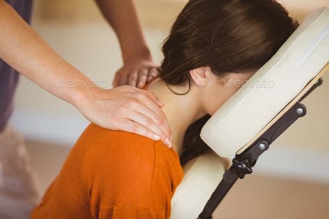 Young woman getting massage in chair in therapy room by Wavebreakmedia. Young woman getting massage in chair in therapy room#massage, #woman, #Young, #chair Chair Massage Techniques, Chair Massage, Prenatal Massage, Chiropractic Clinic, Massage Center, Hot Stone Massage, Massage Benefits, Therapeutic Massage, Baby Massage