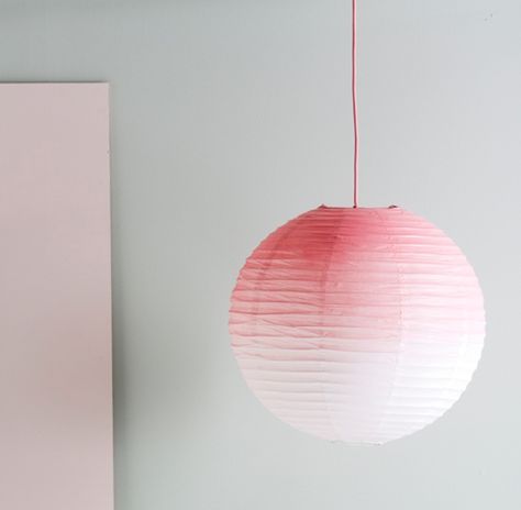 Recreate the look by saturating the top of the lamp with spray paint and allowing the paint to disperse, fading to white. Repeat for the desired effect and finish by spraying the pendant cord pink Paper Lamp Shade, Mommo Design, Orb Light, Interior Props, Diy Hanging Shelves, Diy Ombre, Diy Shades, Ombre Pink, Paper Lampshade