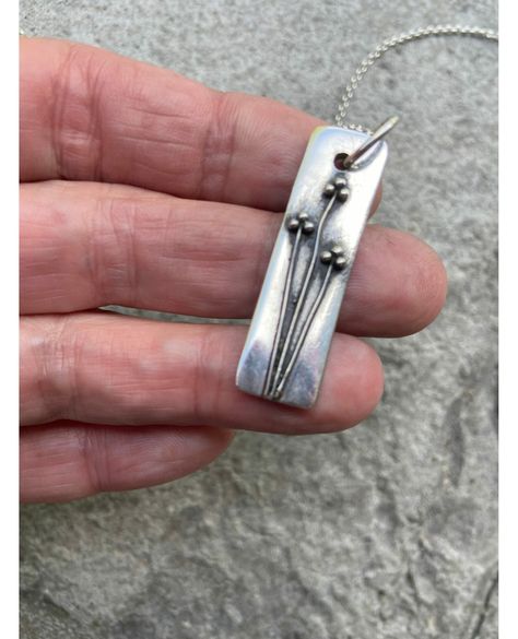 🌸 Give your mom the gift of elegance with our Floral Pendant Sterling Silver Bar Necklace! 🎁 Handcrafted with care and oxidized for a unique finish, this branch necklace is sure to make her feel special. 💕 Perfect for any occasion, it's now on sale for only $127.20! 💰 Don't miss out on this beautiful piece. ✨ #mothersday #jewelry #handmade #floralpendant #sterlingsilver #oxidizedjewelry #giftforher #artisan Pmc Jewelry, Handmade Silver Jewellery, Branch Necklace, Silver Bar Necklace, Metal Clay Jewelry, Necklace Flower, Jewelry Picture, Floral Pendant, Silver Bar