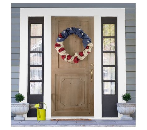 Celebrate your patriotism in a unique and rustic way with this Americana Stars and Stripes burlap wreath. Expertly crafted, this piece beautifully showcases an iconic red, white, and blue motif, making it an ideal decoration for a door, wall, or mantel during Fourth of July festivities. From seasonal celebrations to everyday display, this wreath adds a touch of Americana charm to any space. From Northlight. Fourth Of July Wreath, Colored Burlap, Changing Table Pad, Material Wreaths, July Wreath, Outdoor Bar Table, Nursery Chair, Tree Shop, Pillows Flowers