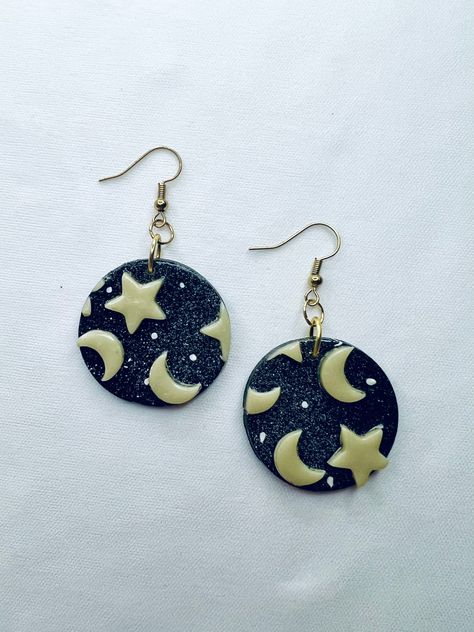 Polymerclay galaxy themed earrings that are also glow in the dark! Polymer Clay Space Theme, Clay Planet Earrings, Handmade Space-themed Earrings For Gift, Glow In The Dark Polymer Clay Earrings, Celestial Clay Earrings, Galaxy Clay Earring, Polymer Inspiration, Polymer Jewelry, Halloween Jewelry