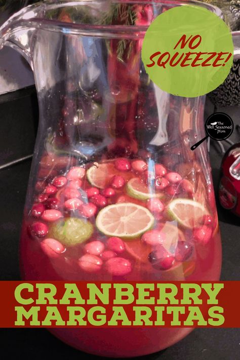 No Squeeze Cranberry Margaritas take the work out of the perfect festive drink! Ideal for Christmas, this easy recipe uses limeade to make a big batch in a flash! #christmasdrink #thanksgiving #holiday #pitcher #tequila Holiday Margaritas Pitcher, Christmas Margaritas Pitcher, Tequila Big Batch Cocktails, Cranberry Margarita Recipe Pitcher, Batch Christmas Margaritas, Batch Cranberry Margarita, Christmas Margarita Recipe Pitcher, Christmas Drinks For Adults Pitcher, Cranberry Margarita Pitcher