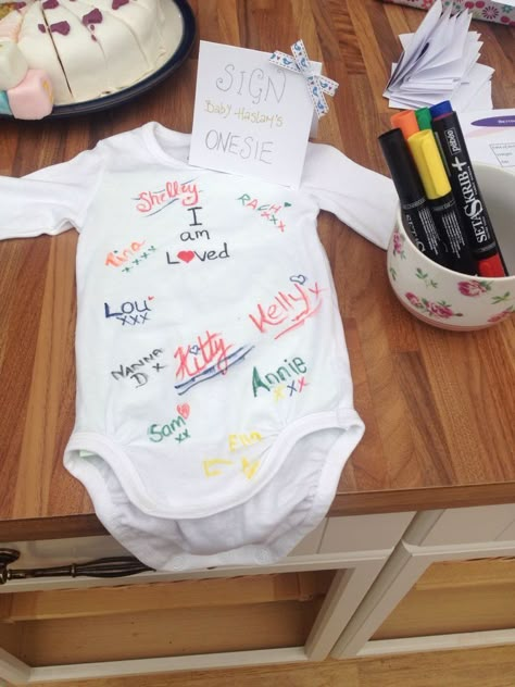 28 HILARIOUS BABY SHOWER GAMES THAT ARE ACTUALLY FUN - Stylin by Sarita Sign The Onesie, Baby Shower Onesie Decorating, Hilarious Baby Shower Games, Baby Shower Game Ideas, Sprinkle Ideas, Shower Activities, Peanut Baby Shower, Valentines Baby Shower