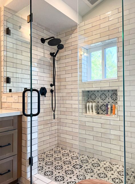 White subway tile in master bathroom shower with black & white patterned floor tile and matte black fixtures. Spanish Bathroom Tile, Spanish Inspired Bathroom, Modern Spanish Bathroom, Spanish Tile Bathroom, Shower Tile Floor, Adu Interior, Classic Bathroom Tile, Tile Shower Floor, White Subway Tile Shower