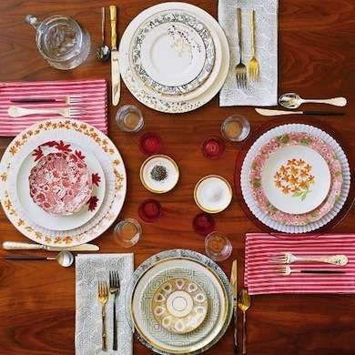 11 DIY Dinnerware and Cutlery Updates - Bob Vila  Mix It Up  Embrace controlled chaos with a thoughtful mix-and-match party, featuring your collection of eclectic dinnerware. The only rule of thumb is to establish a common color scheme, but a mishmash of patterns, shapes, and styles are all welcome at the same table.  Photo: chicheetchouette.com Mismatched Table Setting, Marcus Nilsson, Eclectic Dinnerware, Eclectic Dishes, Mismatched Plates, Mismatched China, Table Scapes, Diy Projects For Beginners, Tea Parties